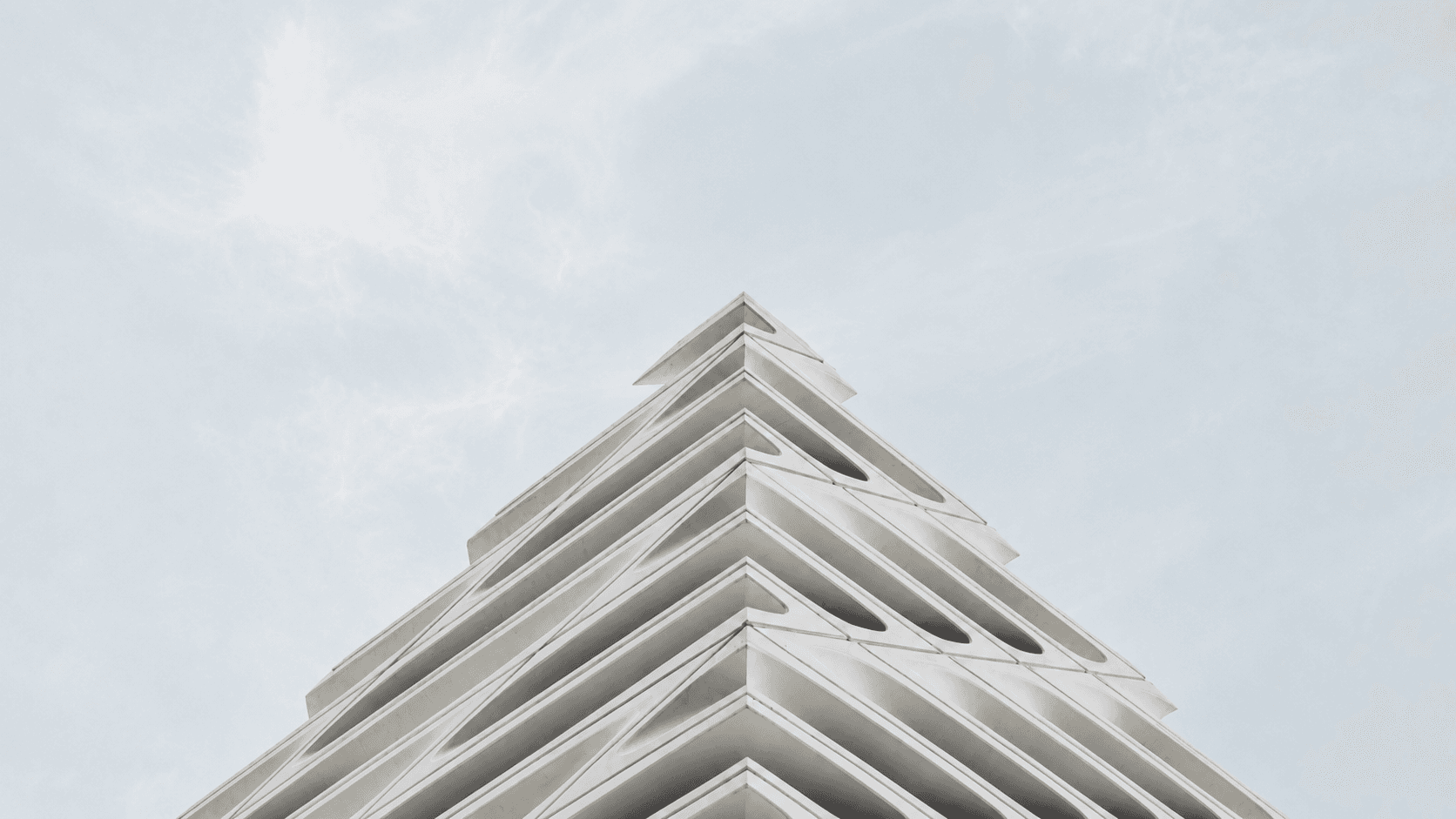 Modern angular architecture building with white geometric facade